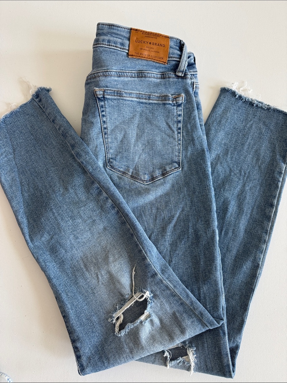 Lucky Brand Women’s Light Blue Skinny Jeans with Distressed Hem